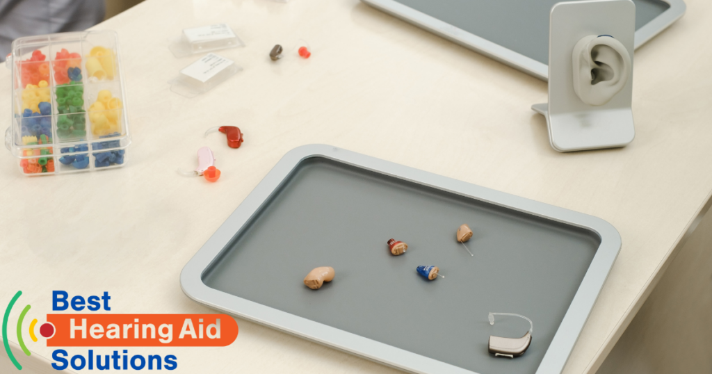 various hearing aids on a tray