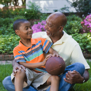 grandfather and grandson with football