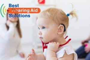 little girl wearing hearing aids