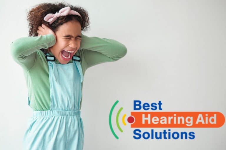 Young girl holding her ears in pain