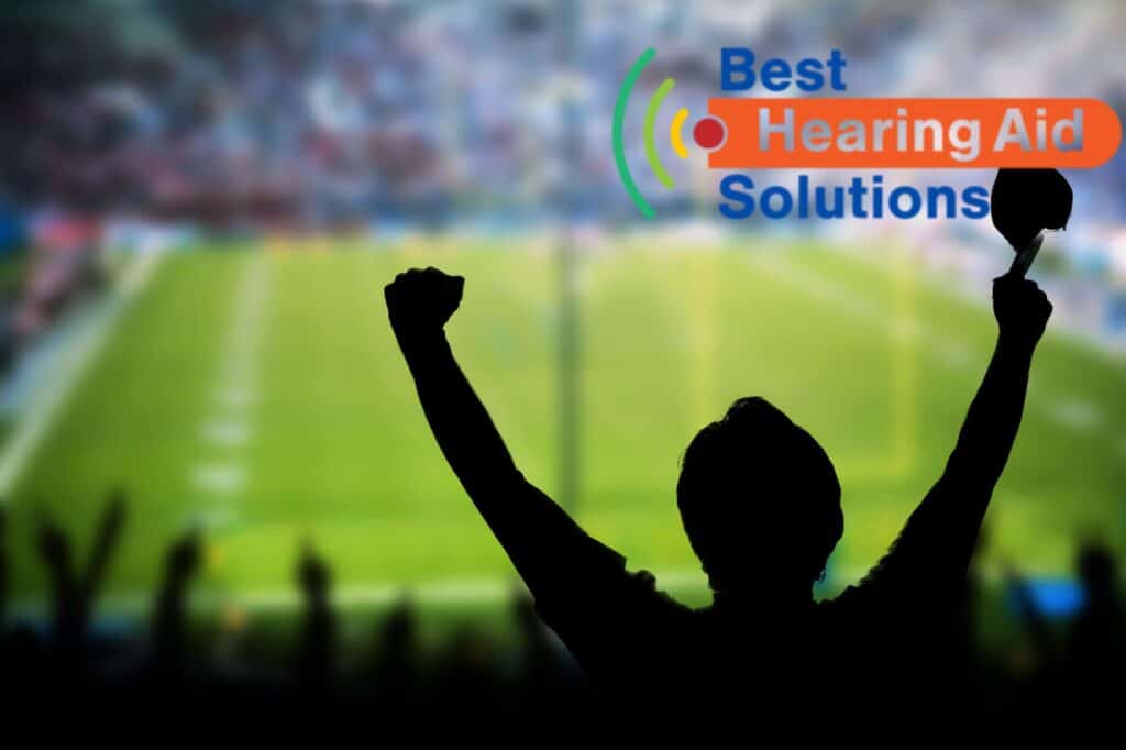 man cheering at a sporting event