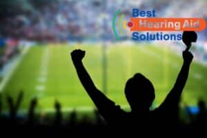 man cheering at a sporting event