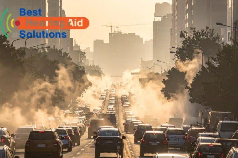 a line of cars stuck in traffic on a smoggy morning