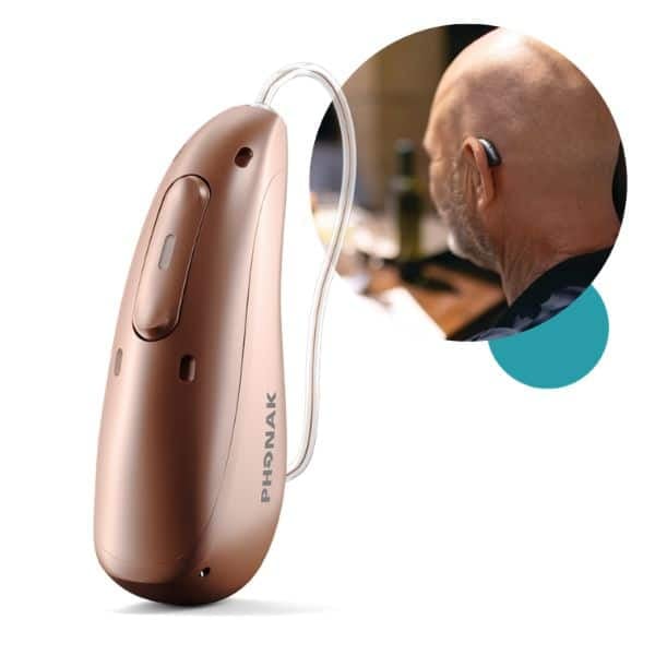 phonak hearing aid and a man wearing one next to it