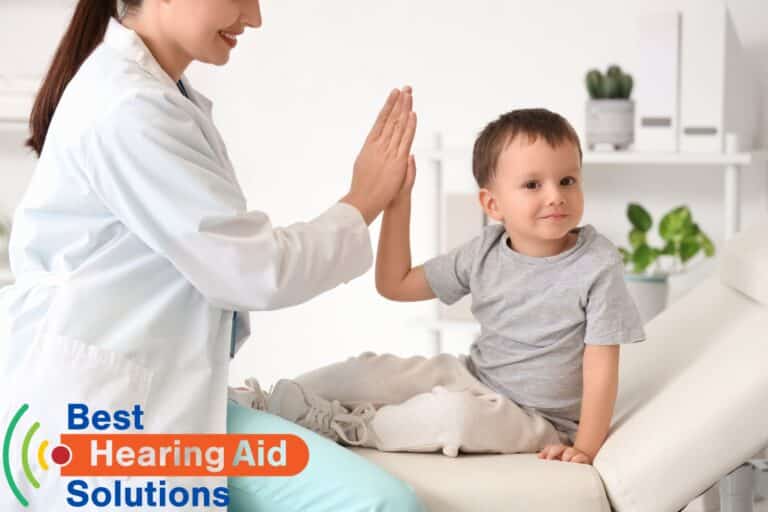 child high fiving a pediatrician